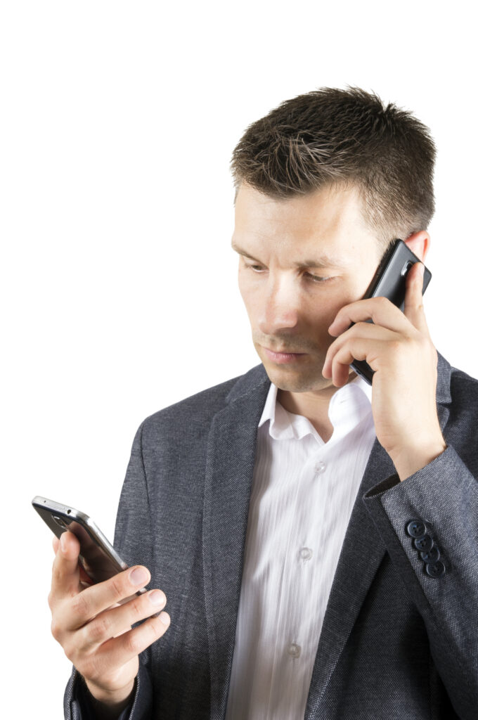 man with 2 cellolar